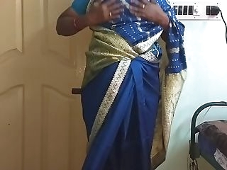 des indian horny cuckold tamil telugu kannada malayalam hindi wife vanitha wearing blue diagonal saree  uniformly ample boobs and shaved pussy press steadfast boobs press snack rubbing pussy masturbation